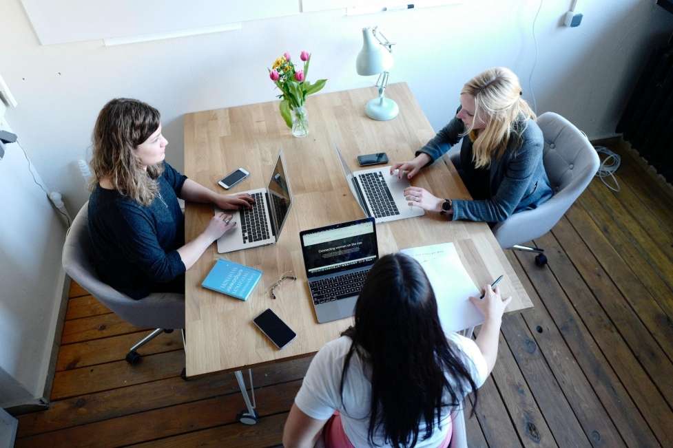 a stock image of some women having a work meeting 