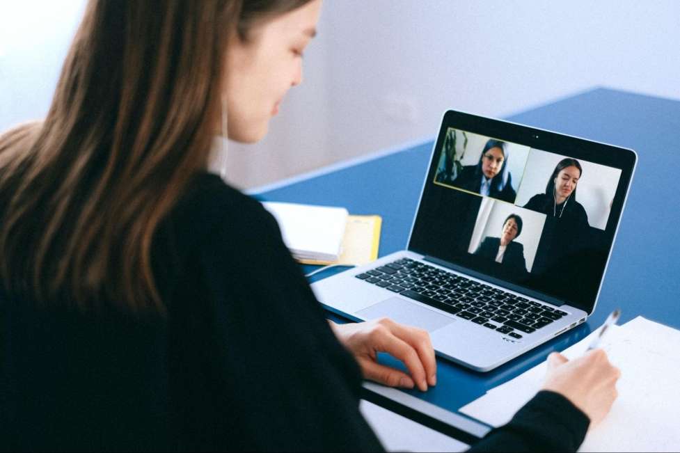 stock image of a woman carrying a job interview virtually 