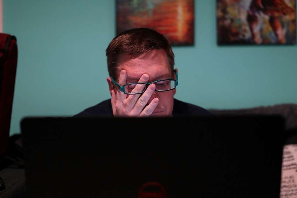 stock image of someone looking worried at work