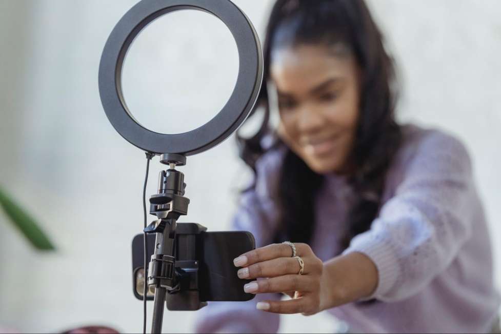 shutter stock influencer arranging the set up for the camera 