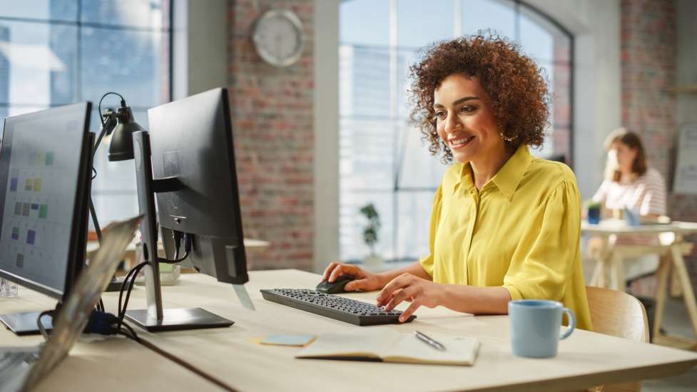 stock image woman working remotely 