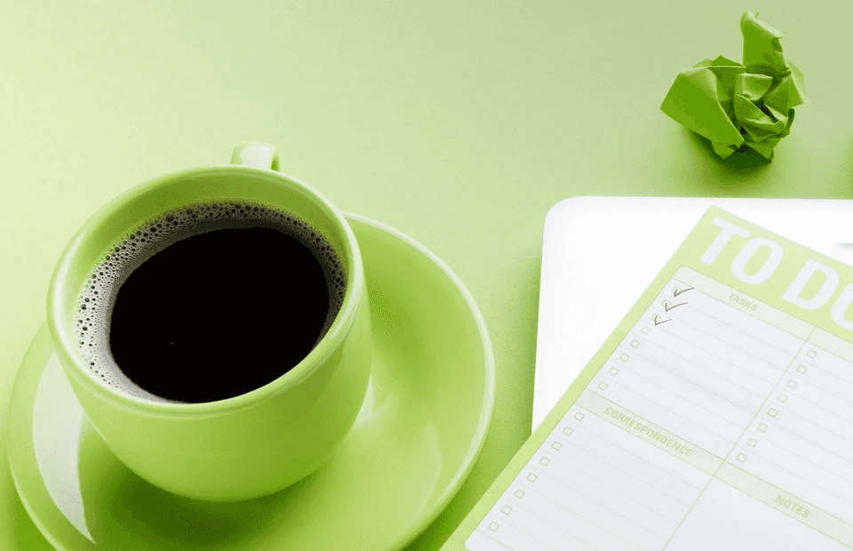 stock image of a coffee and a to-do-list 