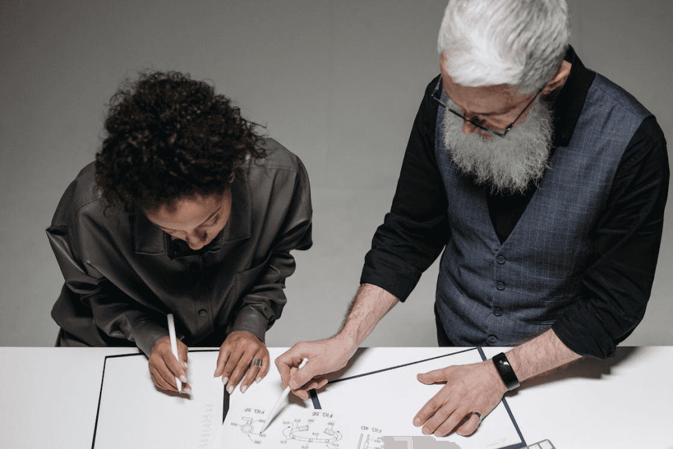 stock image of two people working together