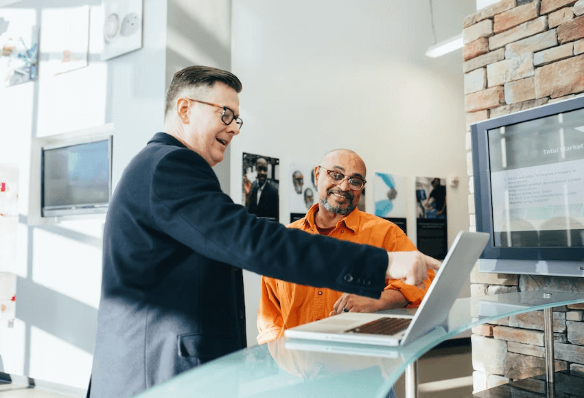 stock image of two people working together 