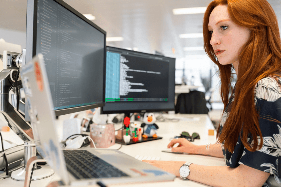 a woman working on his computer 