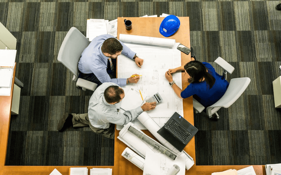 stock image of some architects working together in the office 