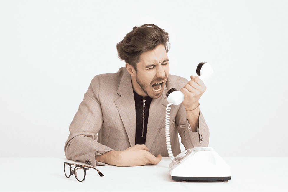 stock image of a person shouting at the phone 