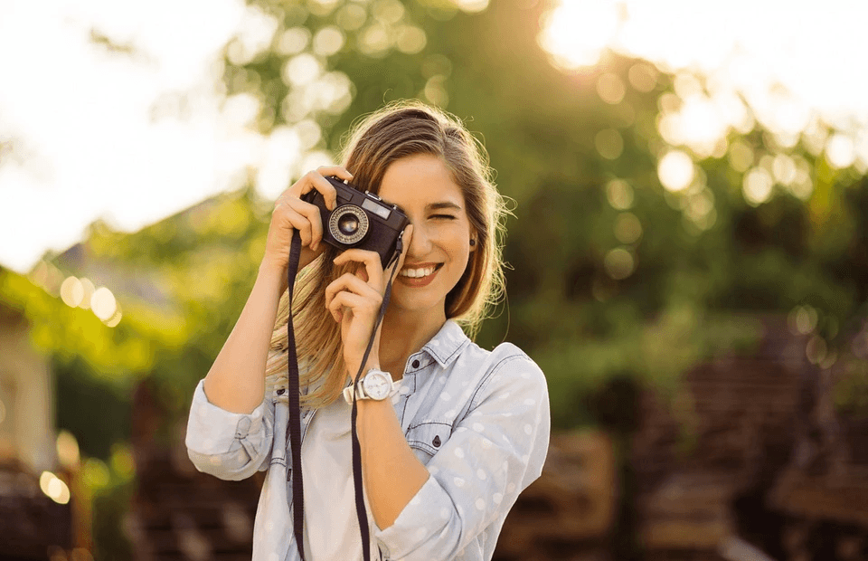 stock image of a woman taking a picture 