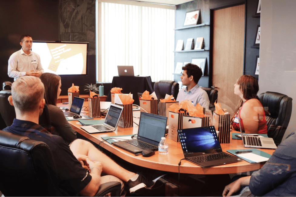 stock image of a meeting taking place in a office 