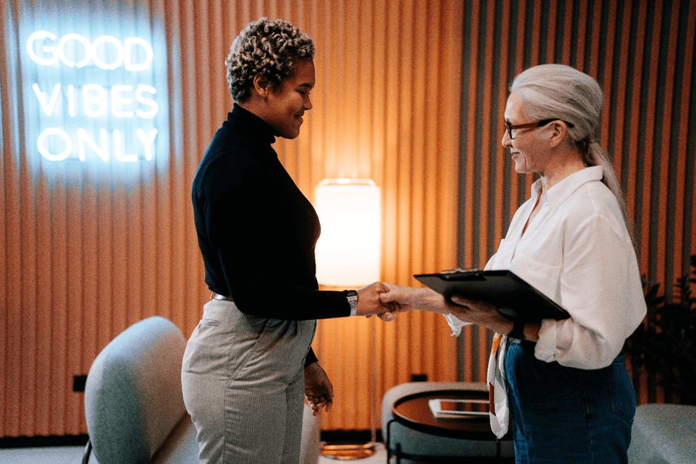 stock image two women talking to each other 